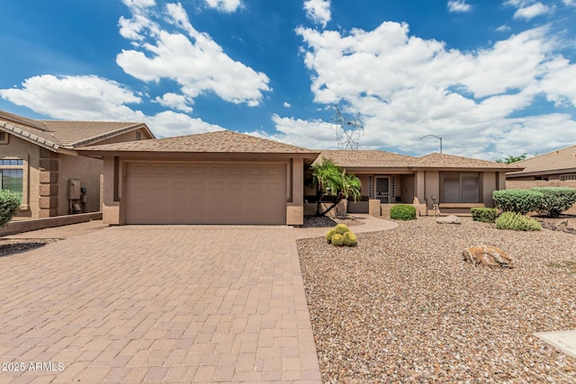 10940 E Olla Ave, Mesa, AZ 85212 - single story home featuring an attached garage, stucco siding, and decorative driveway