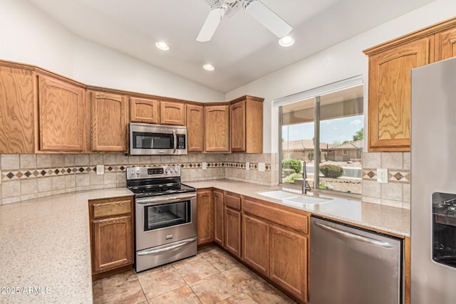 10940 E Olla Ave, Mesa, AZ 85212 - kitchen with appliances with stainless steel finishes, a sink, vaulted ceiling, light countertops, and ceiling fan