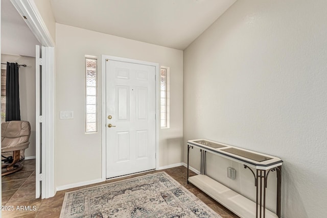 10940 E Olla Ave, Mesa, AZ 85212 - foyer with plenty of natural light, dark tile patterned floors, and baseboards