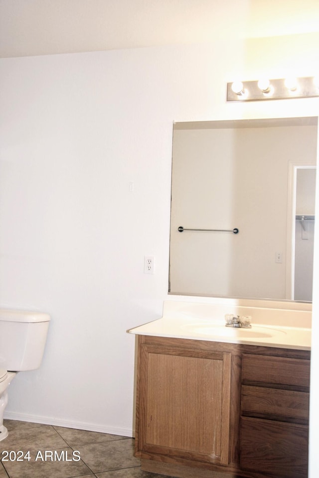9527 N 82nd Ln, Peoria, AZ 85345 - bathroom featuring tile patterned flooring, vanity, and toilet