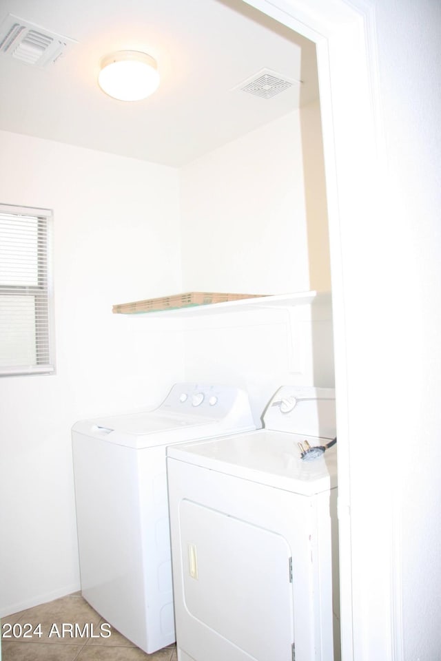 9527 N 82nd Ln, Peoria, AZ 85345 - laundry room featuring light tile patterned floors and washing machine and clothes dryer