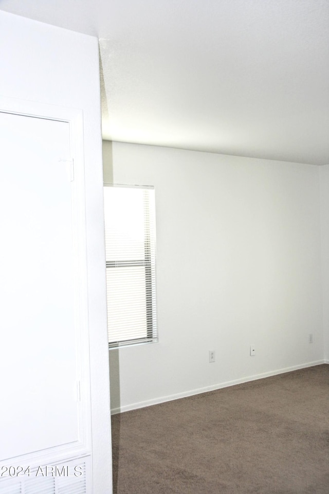 9527 N 82nd Ln, Peoria, AZ 85345 - unfurnished room with dark carpet