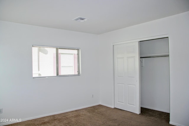9527 N 82nd Ln, Peoria, AZ 85345 - unfurnished bedroom featuring carpet flooring and a closet