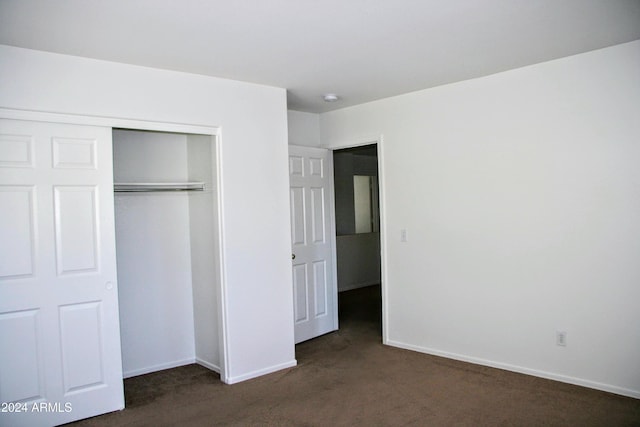 9527 N 82nd Ln, Peoria, AZ 85345 - unfurnished bedroom with dark carpet and a closet