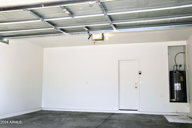 9527 N 82nd Ln, Peoria, AZ 85345 - garage with water heater and a garage door opener