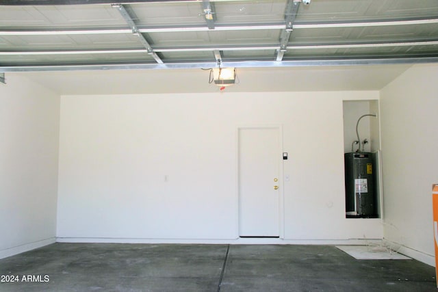 9527 N 82nd Ln, Peoria, AZ 85345 - garage featuring electric water heater and a garage door opener