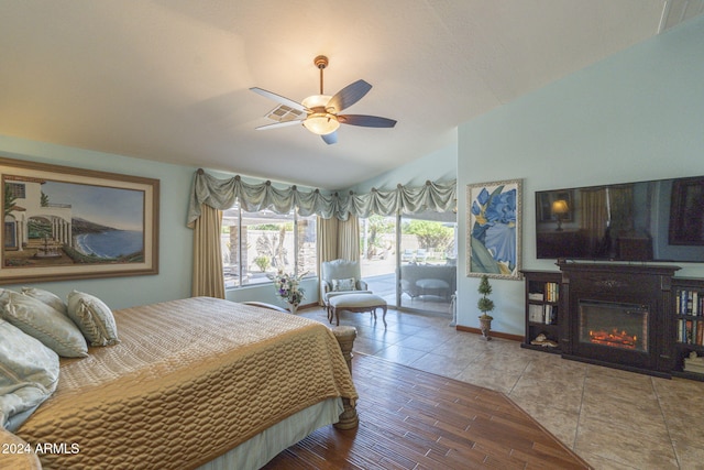 bedroom featuring ceiling fan, lofted ceiling, access to outside, and wood-type flooring