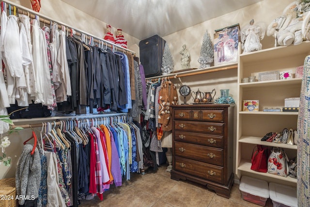 spacious closet featuring light tile patterned flooring