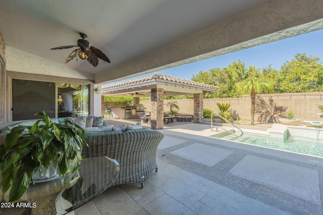 view of patio / terrace featuring an outdoor kitchen and ceiling fan