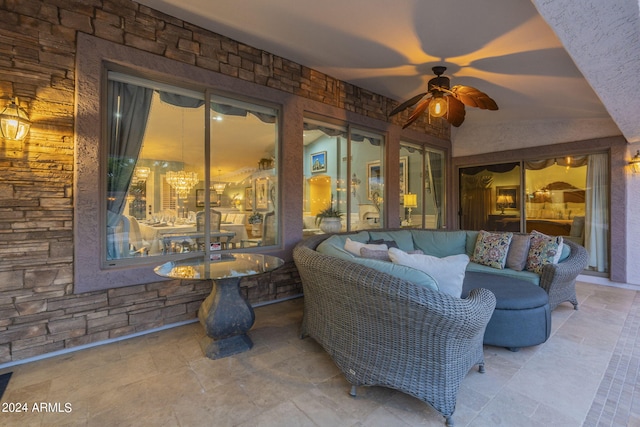 view of patio / terrace with an outdoor living space and ceiling fan