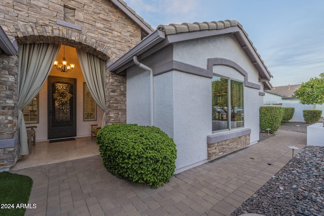 property entrance with a patio