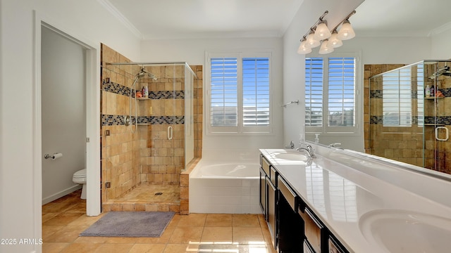 full bathroom featuring vanity, separate shower and tub, toilet, crown molding, and tile patterned floors