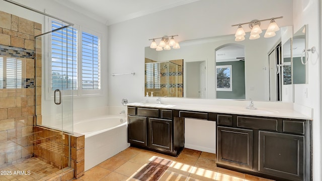 bathroom with ornamental molding, separate shower and tub, vanity, and tile patterned floors