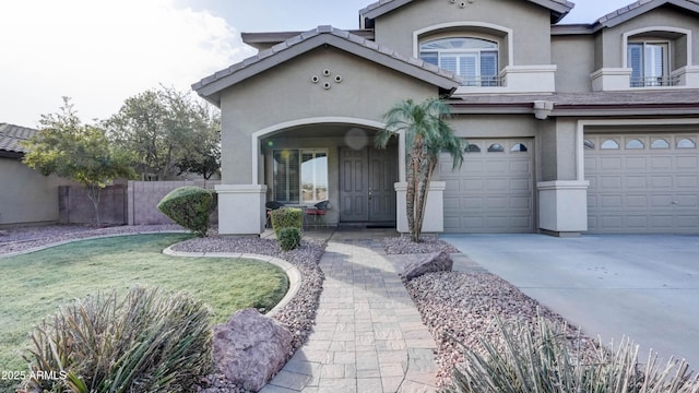 view of front of house featuring a garage and a front lawn