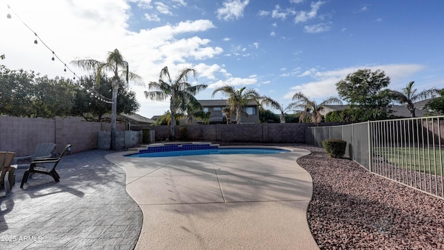 view of swimming pool featuring a patio