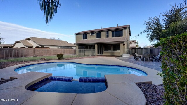 view of pool featuring an outdoor fire pit, a sunroom, and a patio