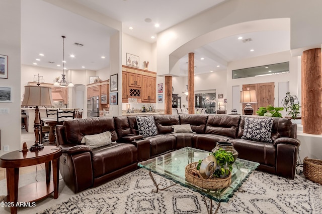 living room featuring decorative columns