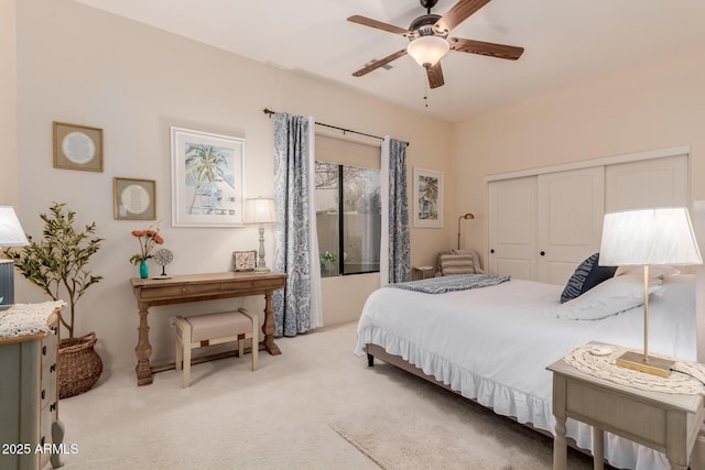 carpeted bedroom with a closet and ceiling fan