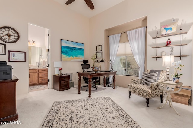 office area featuring ceiling fan and light colored carpet