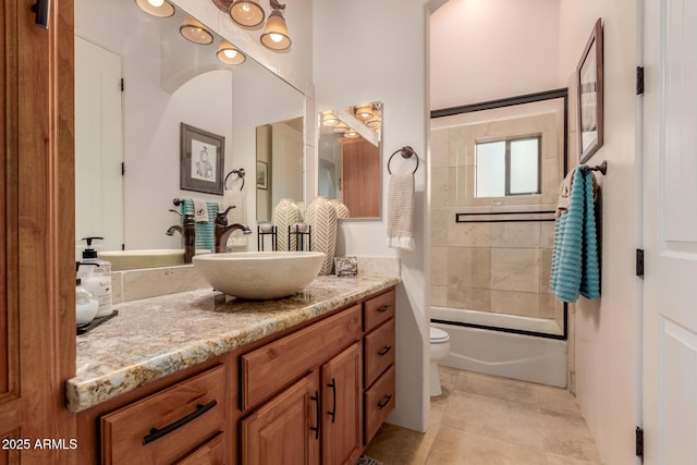 full bathroom with vanity, toilet, tile patterned flooring, and tiled shower / bath combo