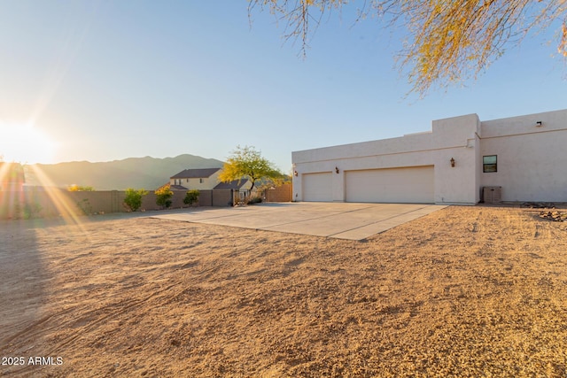 view of front facade featuring a garage and a mountain view