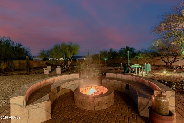 patio terrace at dusk with a fire pit