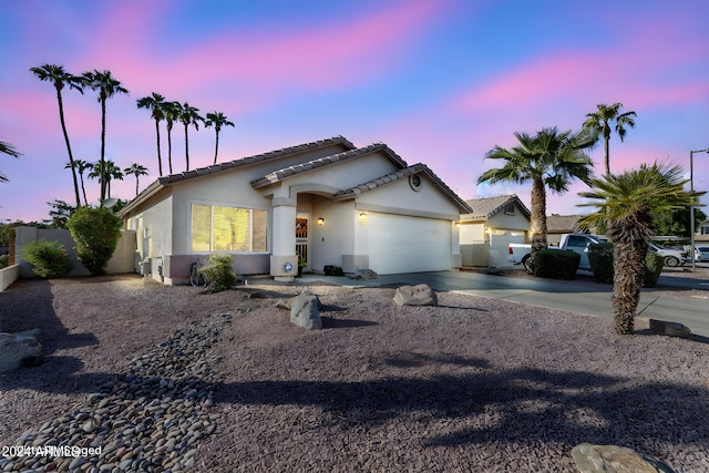 view of front of property with a garage