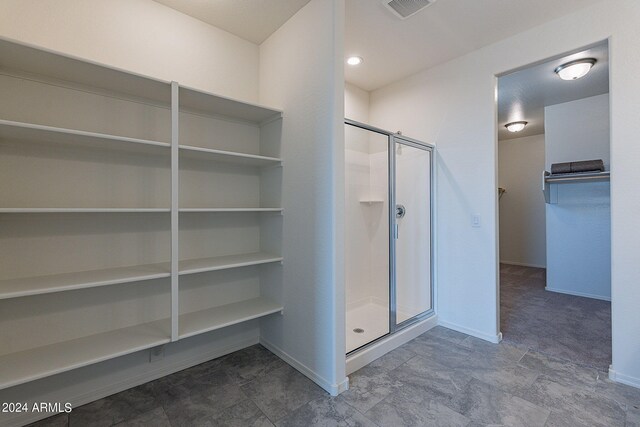 walk in closet featuring carpet