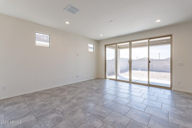 empty room featuring a notable chandelier