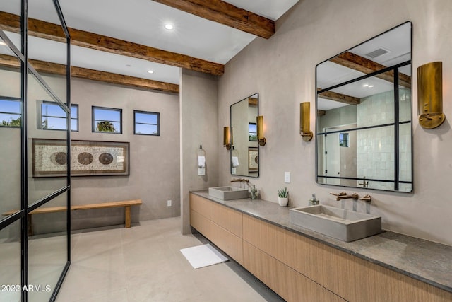bathroom with a sink, visible vents, beam ceiling, and a stall shower