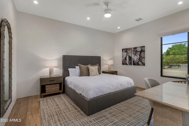 bedroom featuring visible vents, recessed lighting, light wood-type flooring, and a ceiling fan