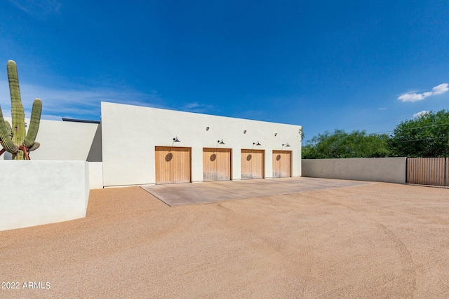 garage with fence