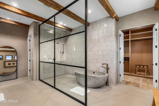 bathroom featuring a shower stall, a freestanding tub, recessed lighting, and beamed ceiling