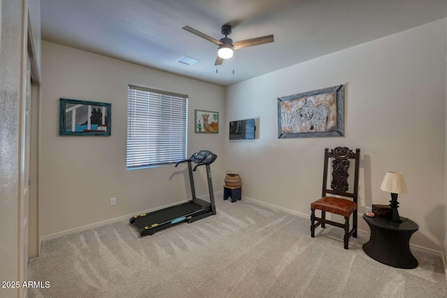 workout area featuring a ceiling fan, carpet, visible vents, and baseboards