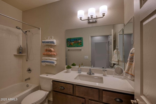 full bathroom featuring washtub / shower combination, vanity, and toilet