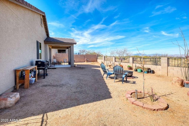 view of yard with a patio area and a fenced backyard