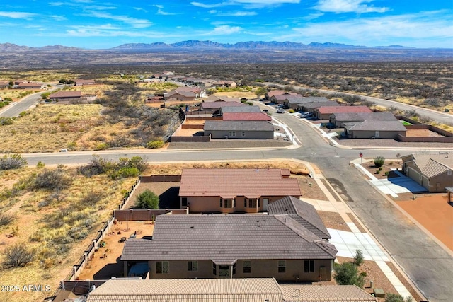 birds eye view of property with a residential view and a mountain view