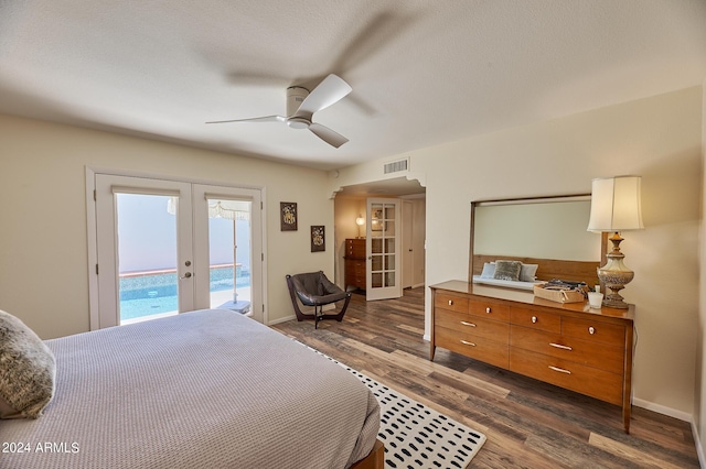 bedroom with french doors, ceiling fan, dark wood-type flooring, and access to outside