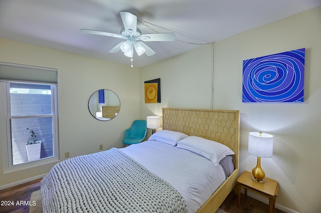 bedroom with hardwood / wood-style floors and ceiling fan