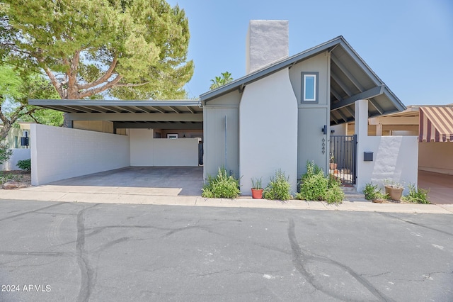 view of side of property featuring a carport