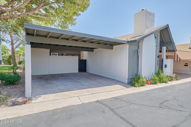 exterior space with a carport