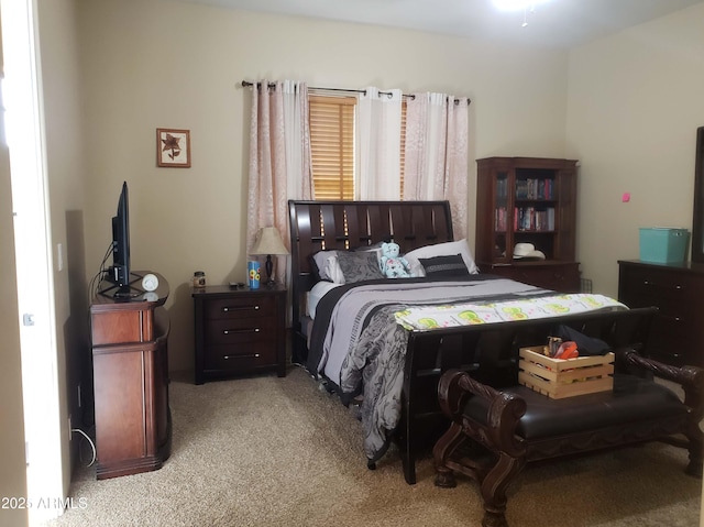 bedroom with light colored carpet