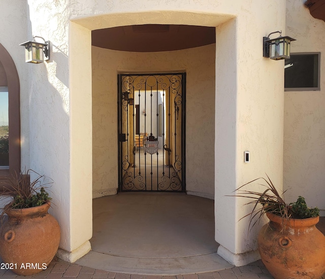 entrance to property with stucco siding