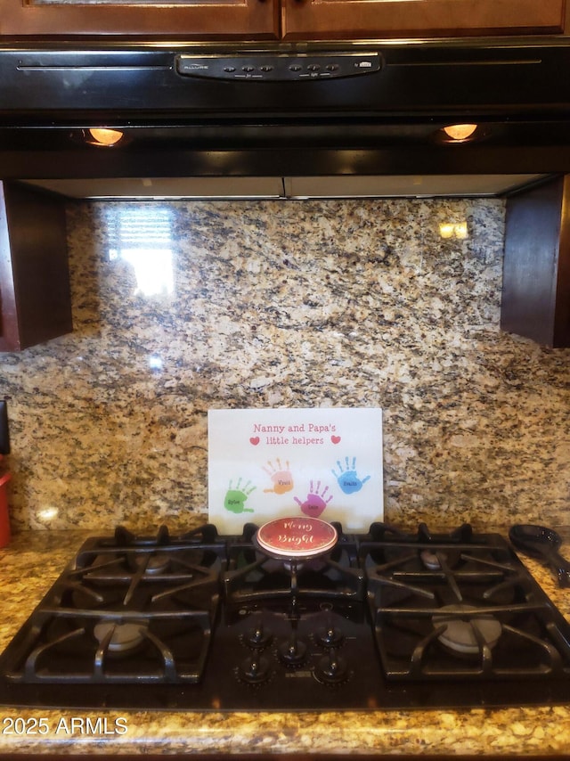 interior details featuring extractor fan and black gas cooktop