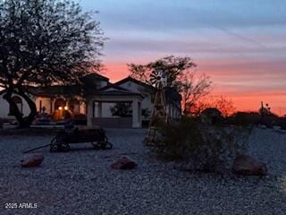 view of back of property at dusk