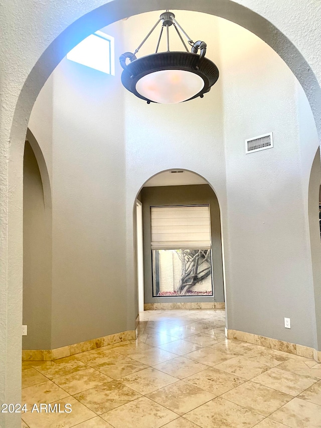 hallway with tile floors