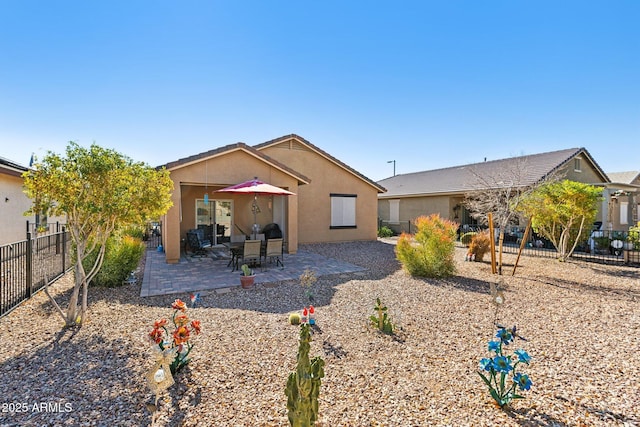 ranch-style home featuring a patio