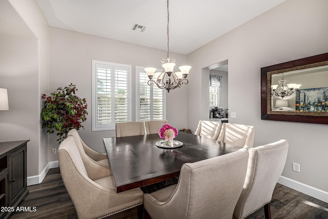 20866 W Werner Pl, Buckeye, AZ 85396 - dining room featuring a chandelier, dark wood finished floors, and baseboards