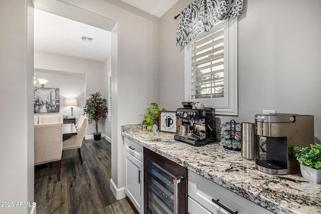 20866 W Werner Pl, Buckeye, AZ 85396 - indoor dry bar featuring wine cooler, dark wood-type flooring, and baseboards