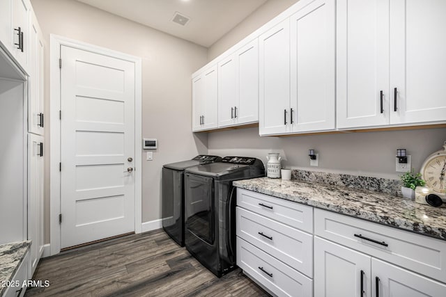 20866 W Werner Pl, Buckeye, AZ 85396 - washroom with cabinet space, washer and clothes dryer, dark wood finished floors, and baseboards